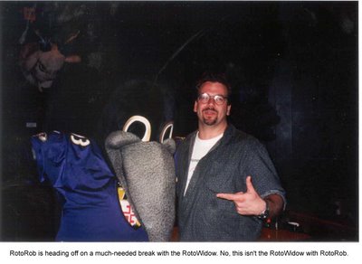 Rob Blackstien, RotoRob, posing with the Baltimore Ravens' mascot.