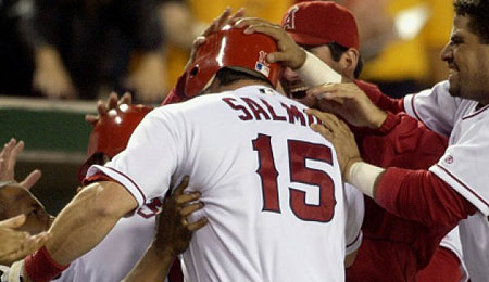 Longtime Los Angeles Angels outfielder Tim Salmon has hung them up.